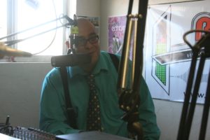 Robert Perea, The Fernley Reporter JFierce Rodriguez talks on the air during the ribbon cutting ceremony at Biggest Little Radio.