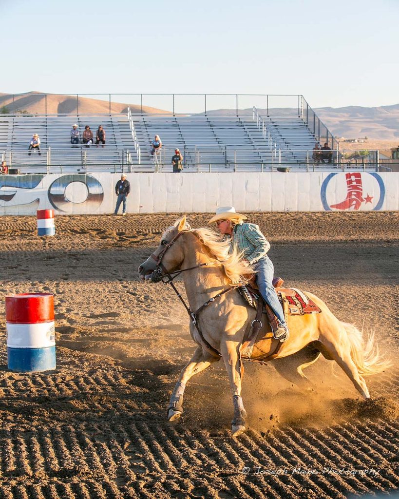 Barrel racing uses the cowboy's horsemanship combined with the horse's athletic ability to steer the horse around the barrels 
