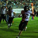 Photos by Anthony Mori, Elko Daily Free Press Fernley enior Nathan Henderson goes into the end zone untouched on a read-option pitch from junior quarterback Zach Burns with 9:38 remaining in the second quarter on 4th-and-5 from the Elko 6 at Warrior Field, tying the score 6-6.